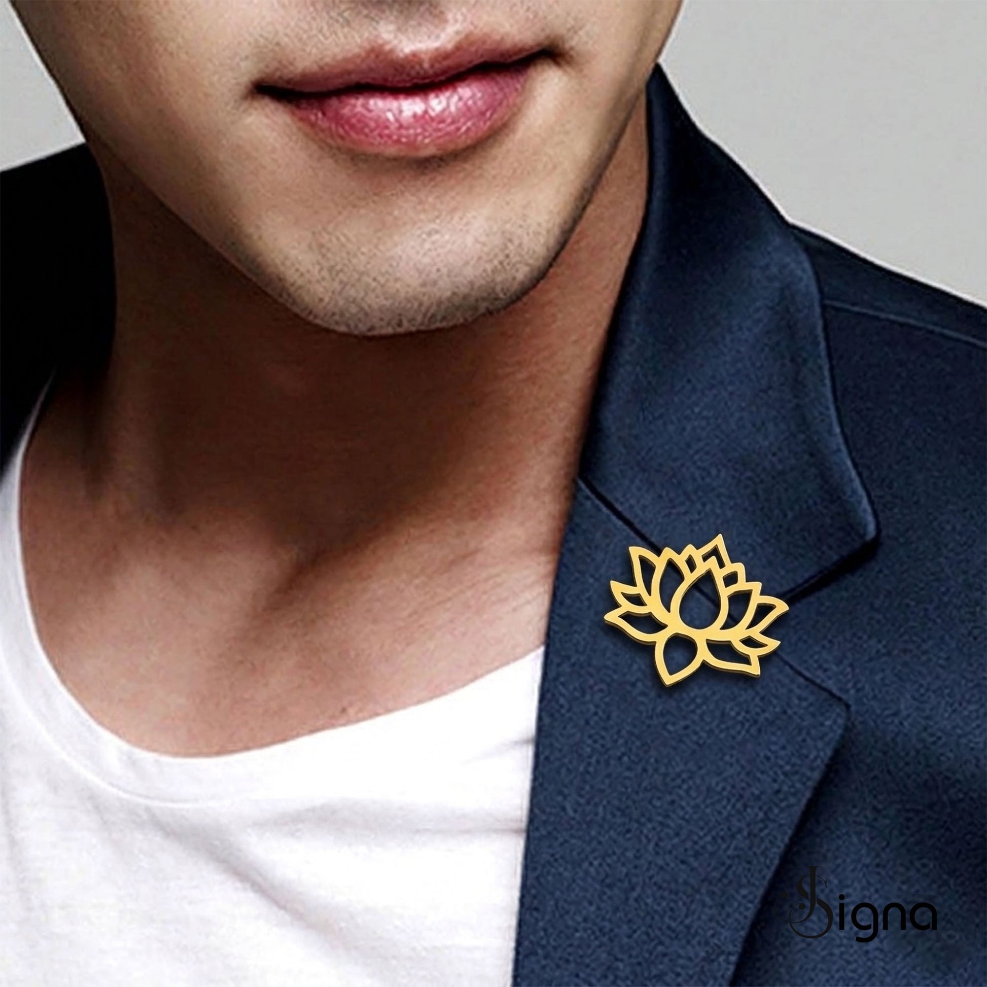 Minimalist lotus brooch by Signa on formal blazer