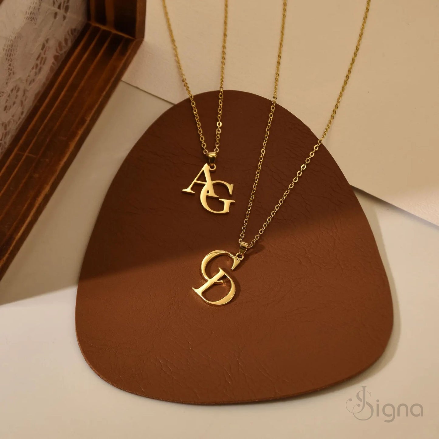 gold plated interlocking initial pendant close up