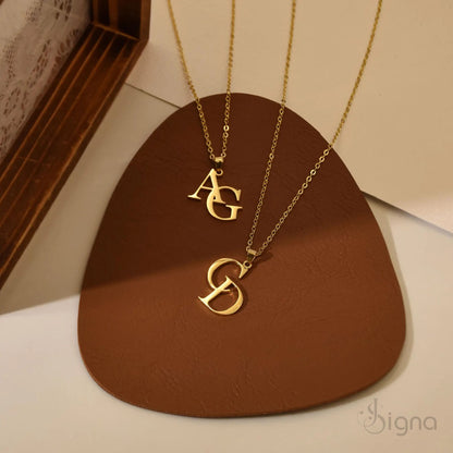 Gold plated interlocking initial pendant close up