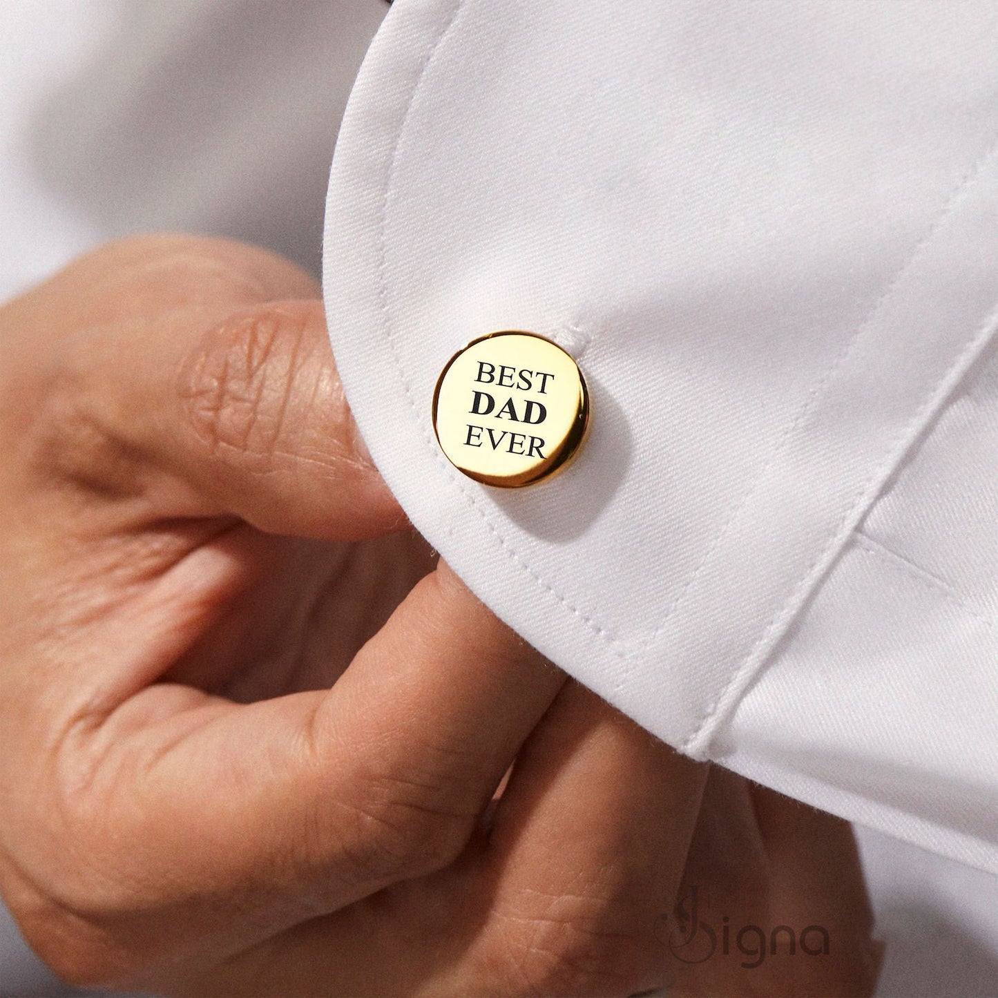 close-up of the black plated custom tie clip and cufflinks for a modern masculine look.