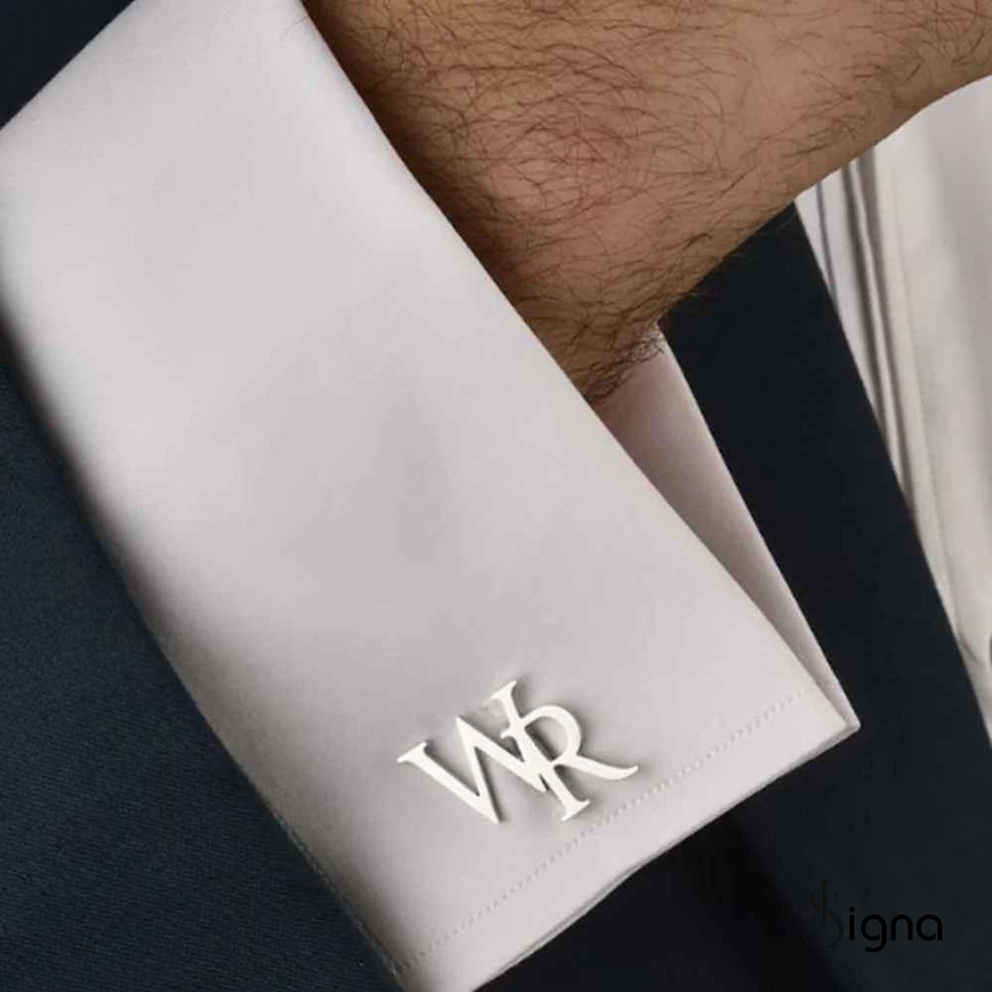 signa elite initial cufflinks for men in polished silver, featuring a bold precision-cut letter 'a' on a french cuff shirt.