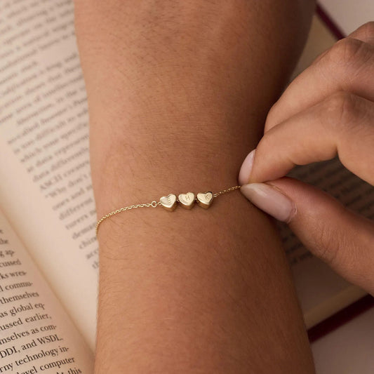 Signa™ three heart initial charm bracelet in gold