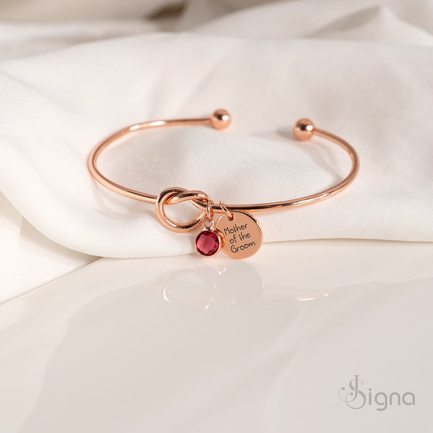 personalized jessie name charm bracelet with red birthstone detail