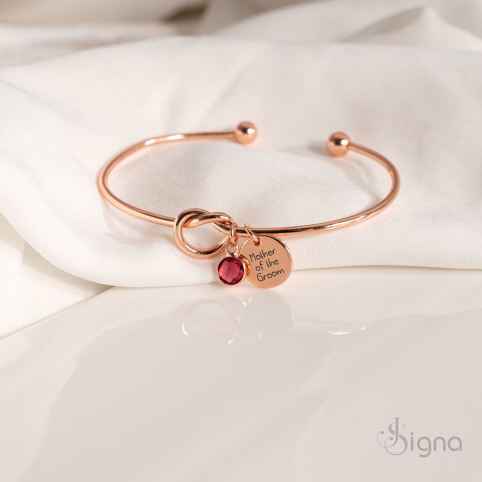 Personalized Jessie name charm bracelet with red birthstone detail