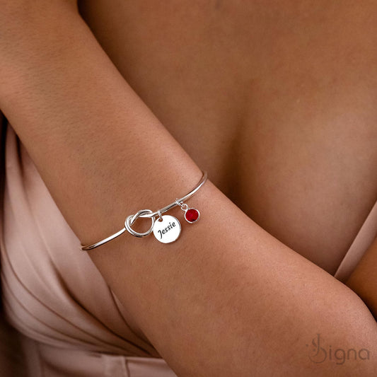 Custom name and birthstone gold tie-knot bangle bracelet for women