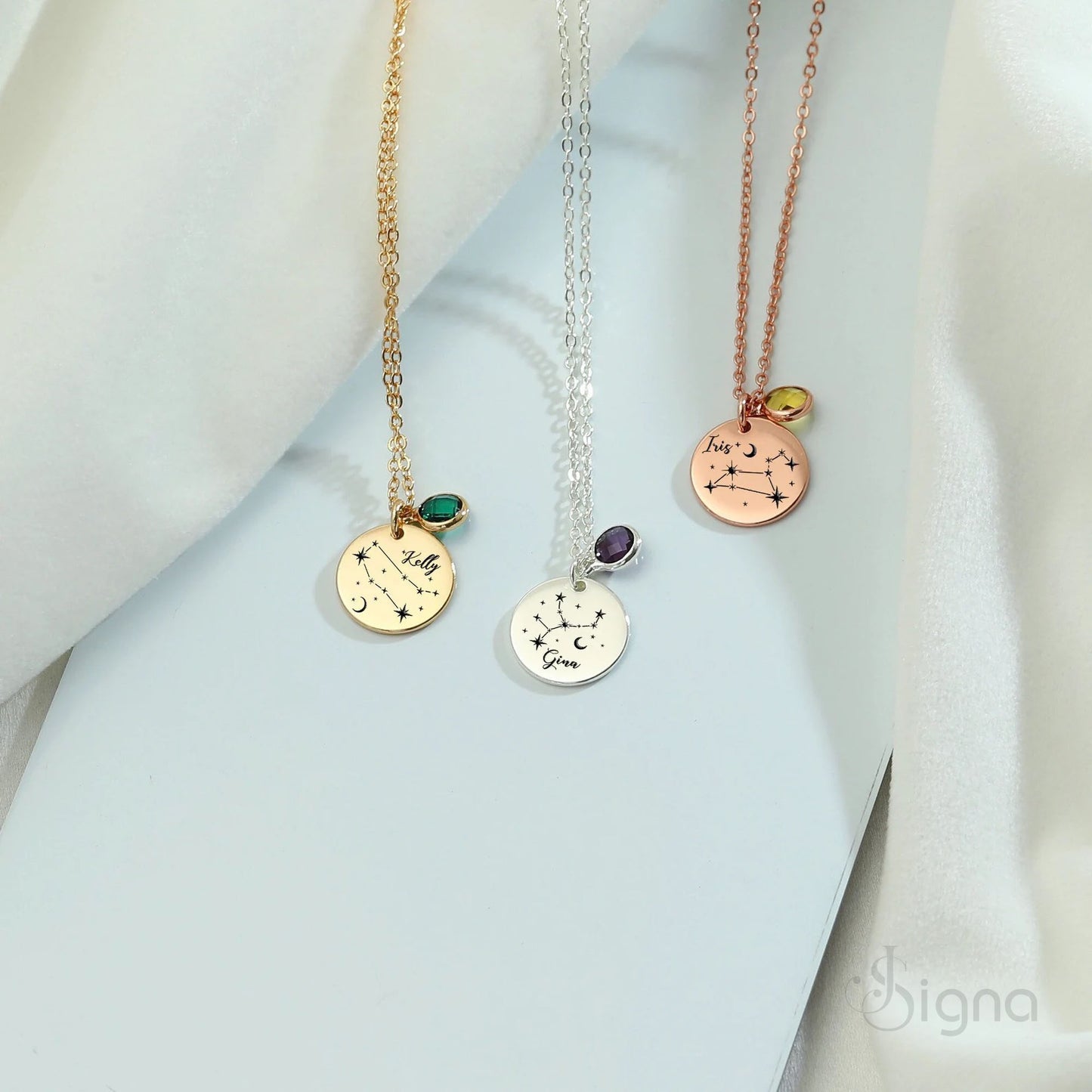 close up of zodiac star constellation pendant with colorful birthstone crystal